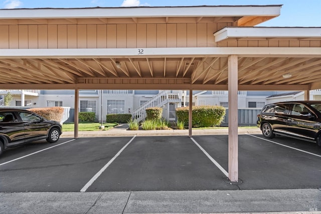 view of vehicle parking featuring a carport