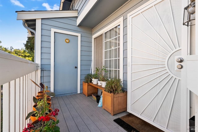 property entrance with a deck