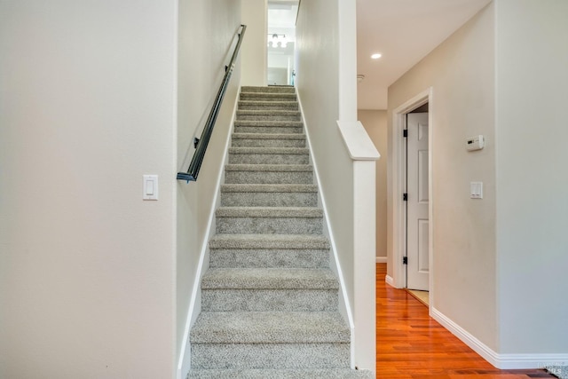 stairway with wood-type flooring