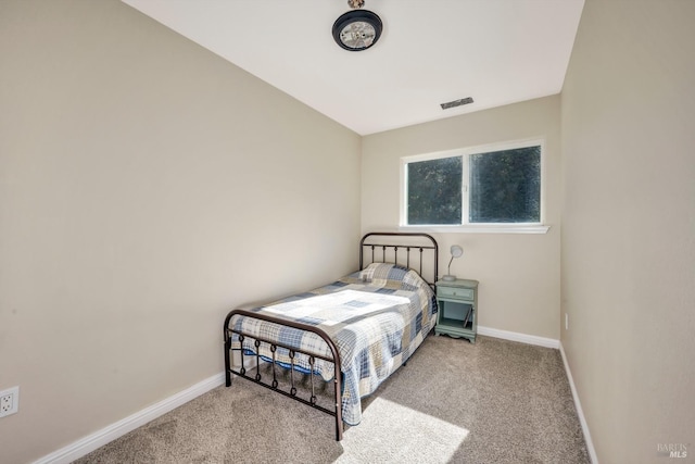 bedroom with light carpet