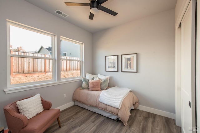 bedroom featuring a closet, hardwood / wood-style flooring, and ceiling fan