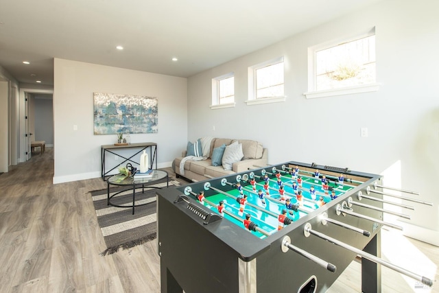 recreation room with hardwood / wood-style floors