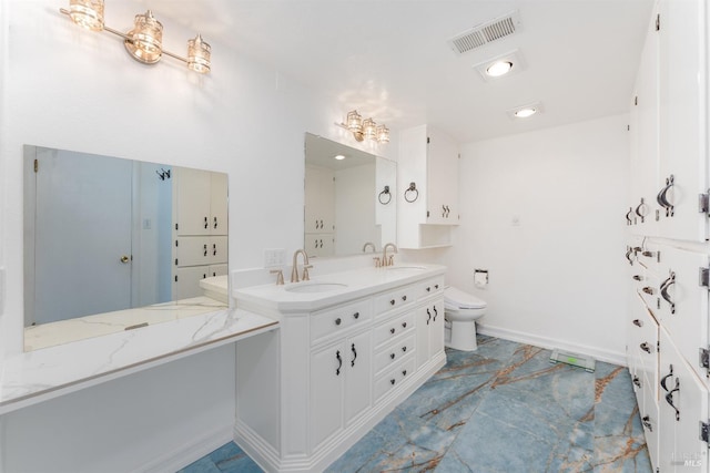 bathroom with vanity and toilet