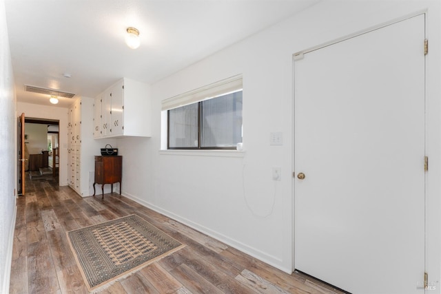 hallway featuring hardwood / wood-style floors and plenty of natural light