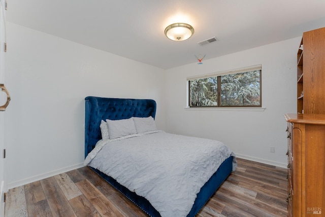 bedroom featuring dark wood-type flooring