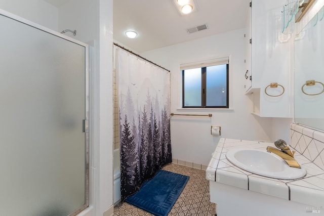 bathroom with tile patterned floors, vanity, and backsplash