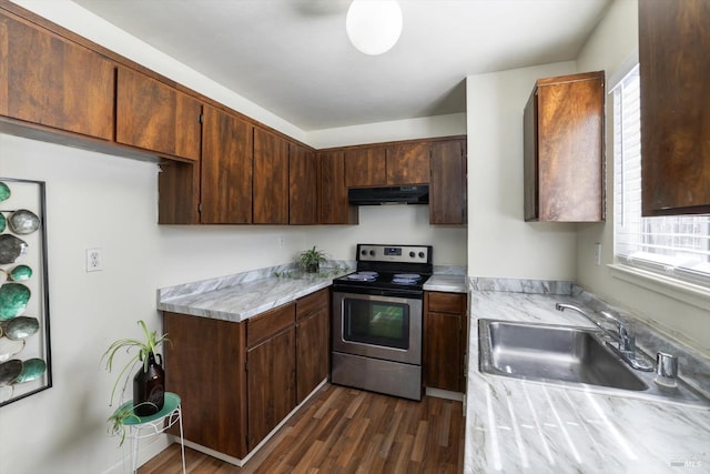 kitchen featuring exhaust hood, dark brown cabinets, sink, stainless steel electric range oven, and dark hardwood / wood-style flooring