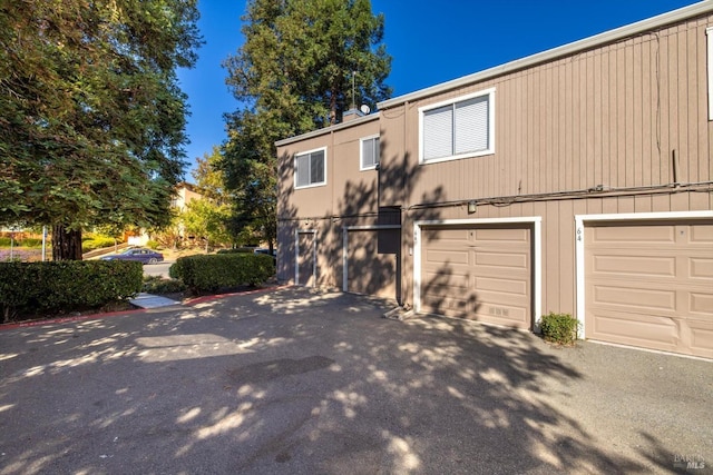 view of side of property featuring a garage