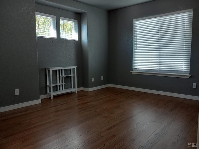 empty room featuring hardwood / wood-style flooring