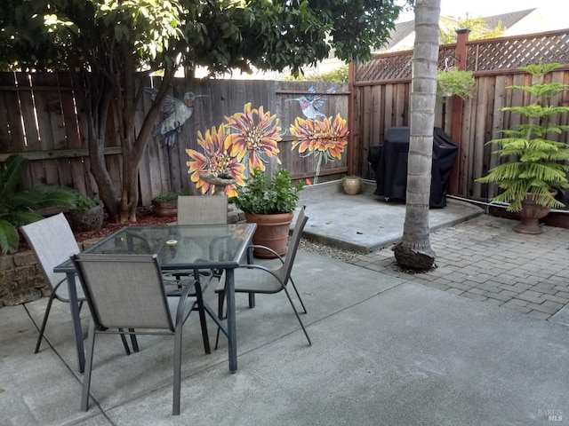 view of patio with a grill