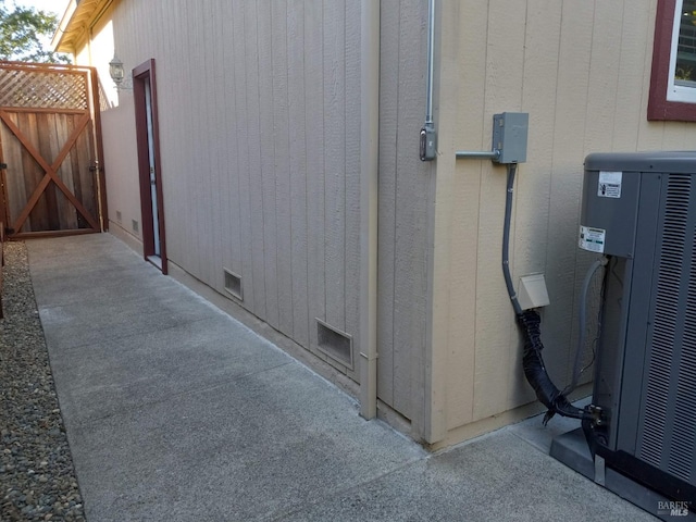 view of side of property featuring central air condition unit