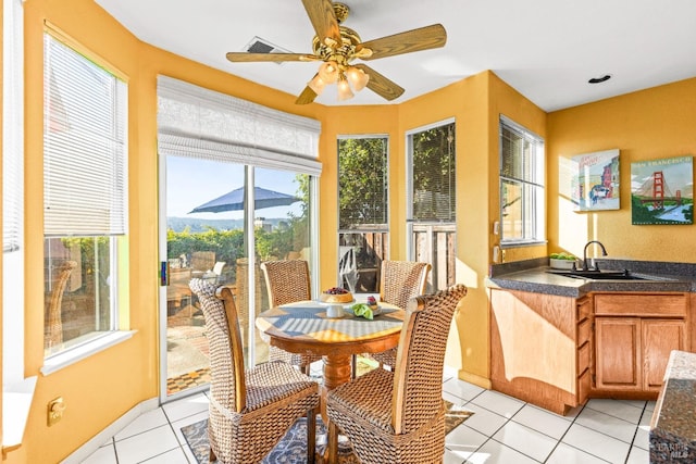 interior space with ceiling fan and sink