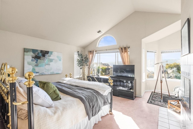 carpeted bedroom featuring high vaulted ceiling