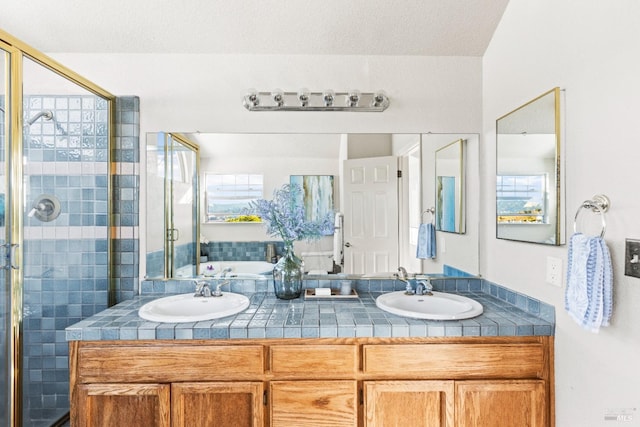 bathroom with vanity and a shower with shower door