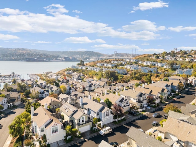 birds eye view of property featuring a residential view and a water view