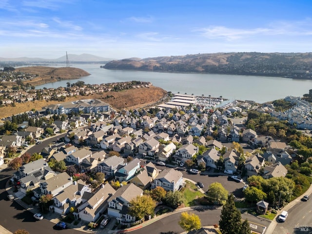 birds eye view of property with a water view and a residential view