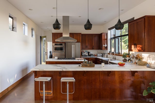 kitchen featuring appliances with stainless steel finishes, sink, hanging light fixtures, and island range hood