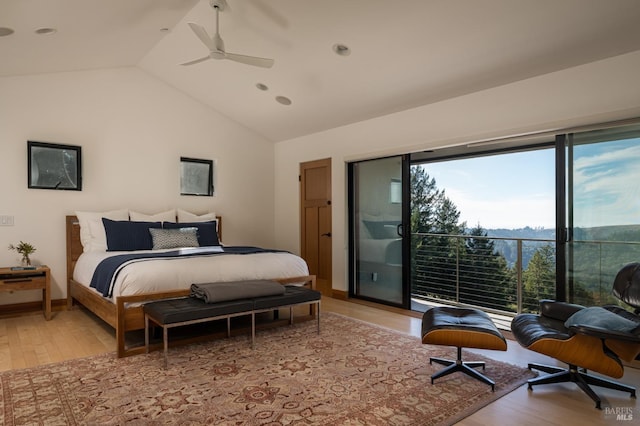 bedroom with light hardwood / wood-style flooring, lofted ceiling, and ceiling fan