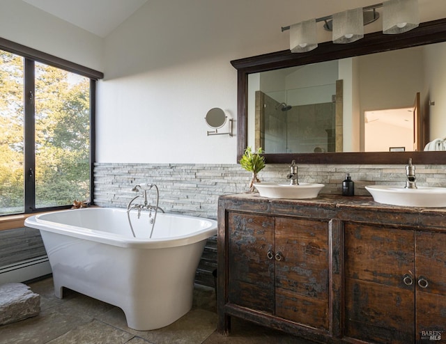 bathroom with baseboard heating, vanity, shower with separate bathtub, and lofted ceiling