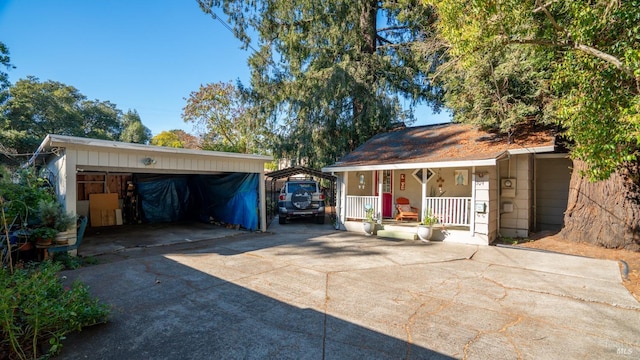 exterior space featuring covered porch and a carport