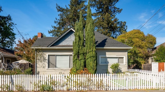 705 Tupper St, Santa Rosa, CA 95404 - bungalow-style house with a fenced front yard and a chimney