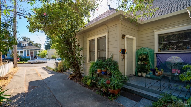 705 Tupper St, Santa Rosa, CA 95404 - view of home's exterior with a shingled roof and fence