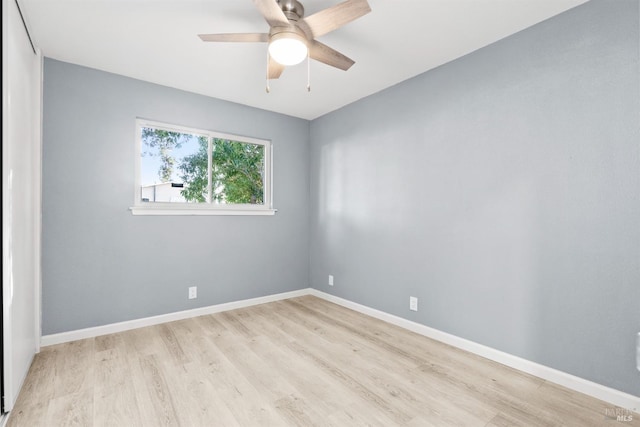 empty room featuring ceiling fan and light hardwood / wood-style flooring