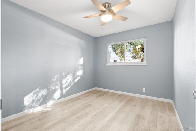 spare room featuring light hardwood / wood-style floors and ceiling fan