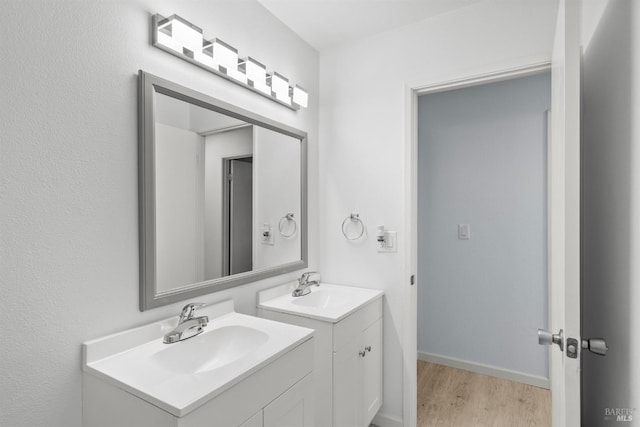 bathroom with vanity and hardwood / wood-style floors