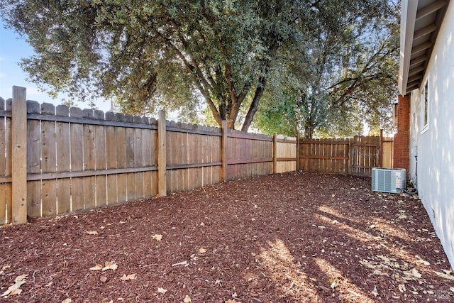 view of yard with central AC