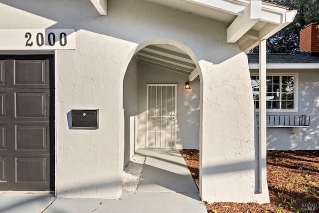 entrance to property featuring a garage