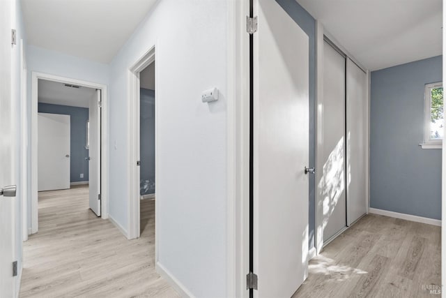 hallway featuring light wood-type flooring