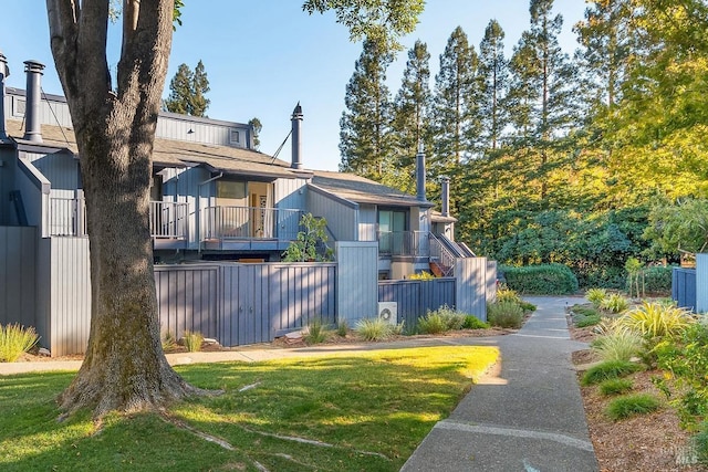 exterior space with a lawn and stairway