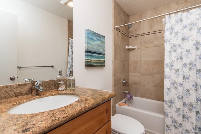 bathroom with vanity, toilet, and shower / tub combo