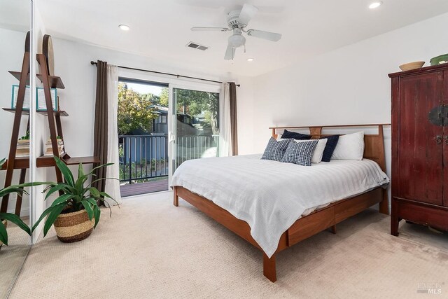 carpeted bedroom featuring access to exterior and ceiling fan