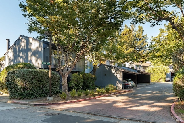 view of side of property with covered parking
