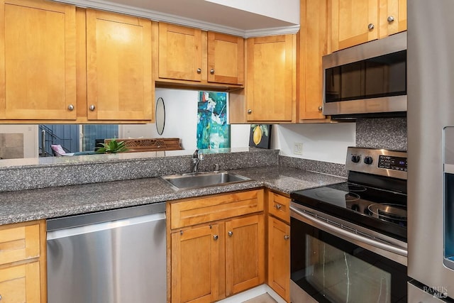 kitchen featuring appliances with stainless steel finishes, sink, and decorative backsplash