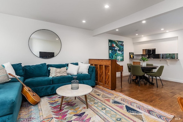 living room featuring wood-type flooring and beamed ceiling