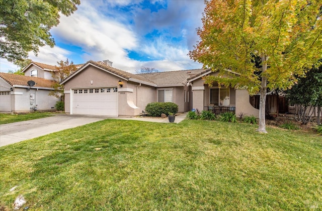 view of front of property with a garage and a front yard