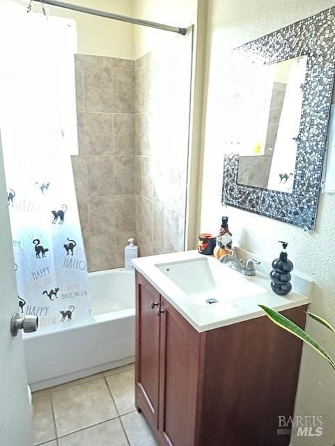 bathroom featuring vanity, shower / tub combo, and tile patterned flooring