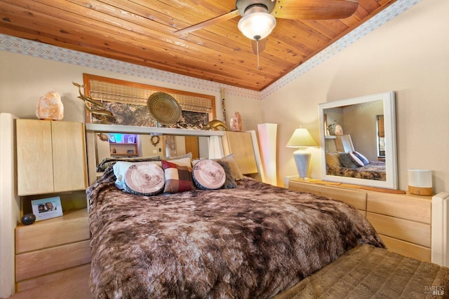 bedroom with vaulted ceiling, wood ceiling, and ceiling fan