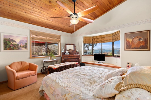 bedroom with vaulted ceiling, wood ceiling, carpet flooring, and ceiling fan