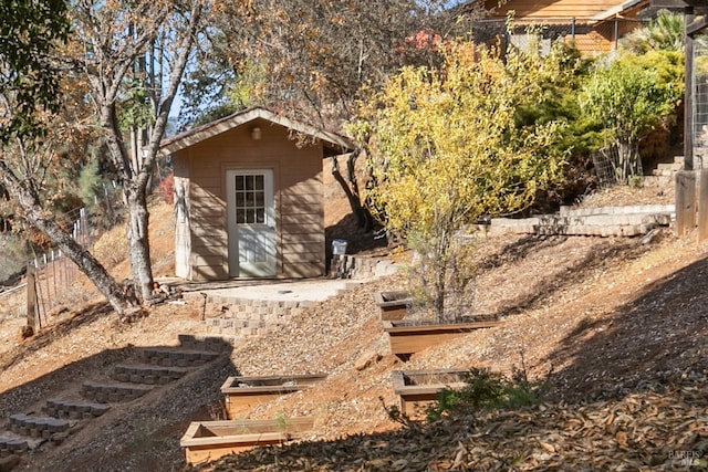 exterior space featuring a storage unit