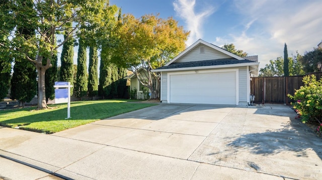 view of front facade featuring a garage and a front yard