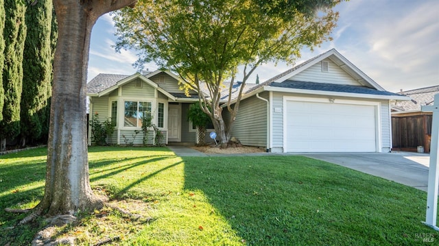 view of front facade with a garage and a front lawn