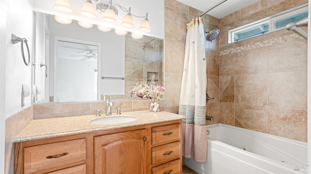 bathroom featuring shower / bath combination with curtain, vanity, and a ceiling fan