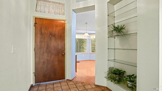 corridor featuring tile patterned flooring