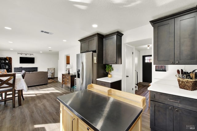 dining area featuring an inviting chandelier and dark hardwood / wood-style flooring