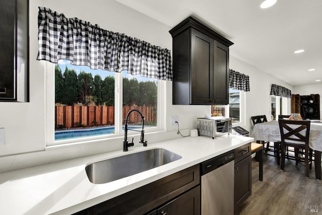 kitchen featuring sink, stainless steel appliances, and dark hardwood / wood-style floors