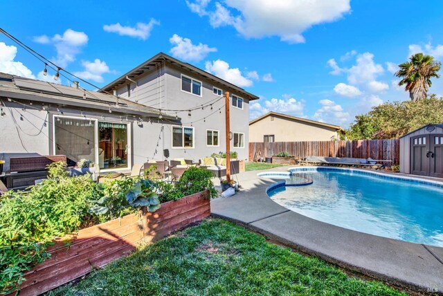 view of swimming pool featuring a gazebo, a storage shed, and a lawn